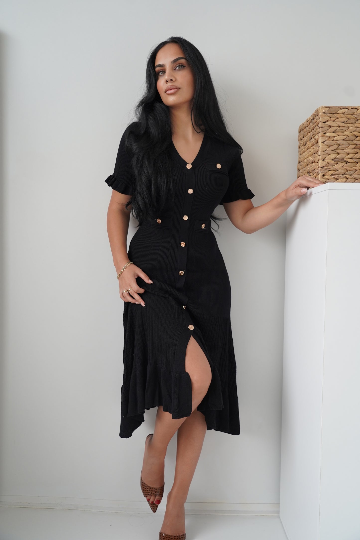 Timeless black midi dress crafted in ribbed fabric
