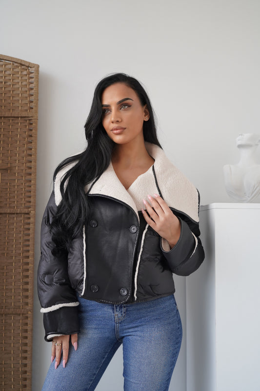 Cropped jacket crafted in leather-look fabric, lined with soft faux shearling for maximum warmth.