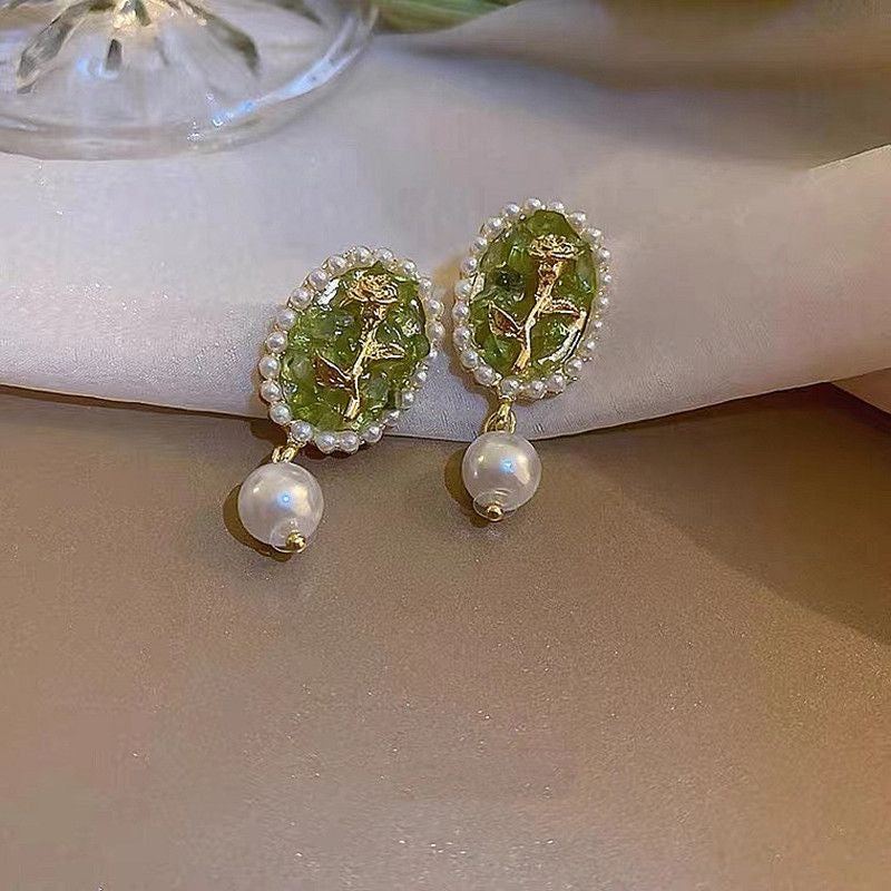 Green earrings with flowers