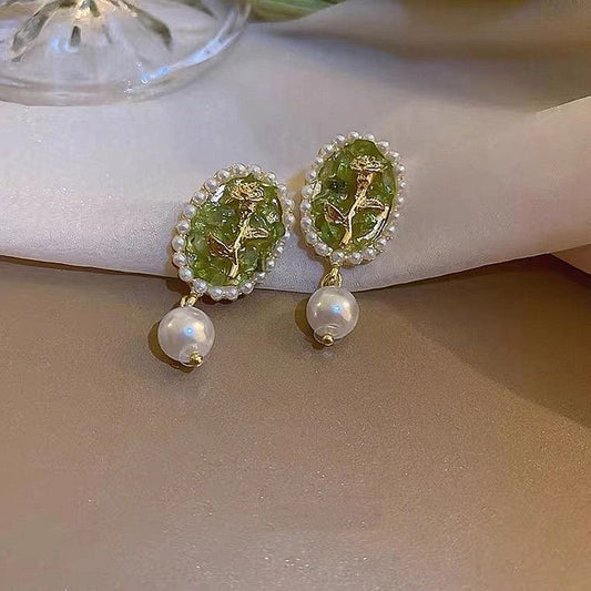 Green earrings with flowers