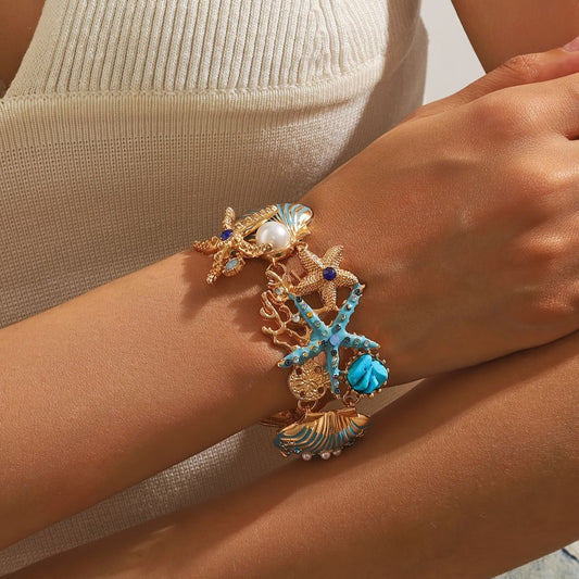 Ocean-Inspired Charm Bracelet – Gold & Turquoise Details