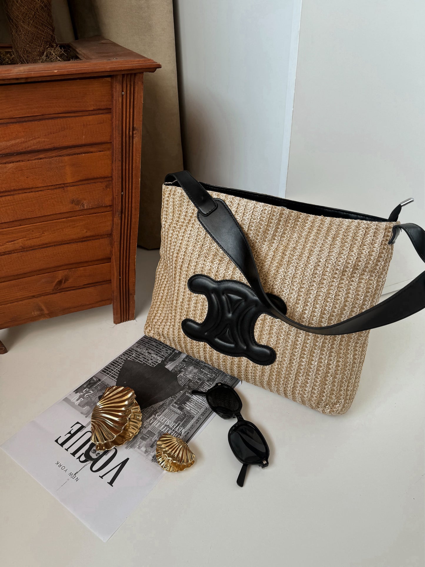 Elegant Woven Straw Shoulder Bag with Black Leather Accent