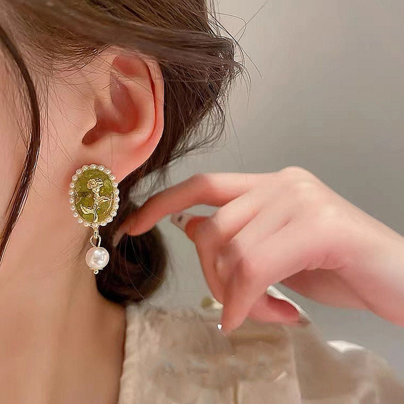 Green earrings with flowers