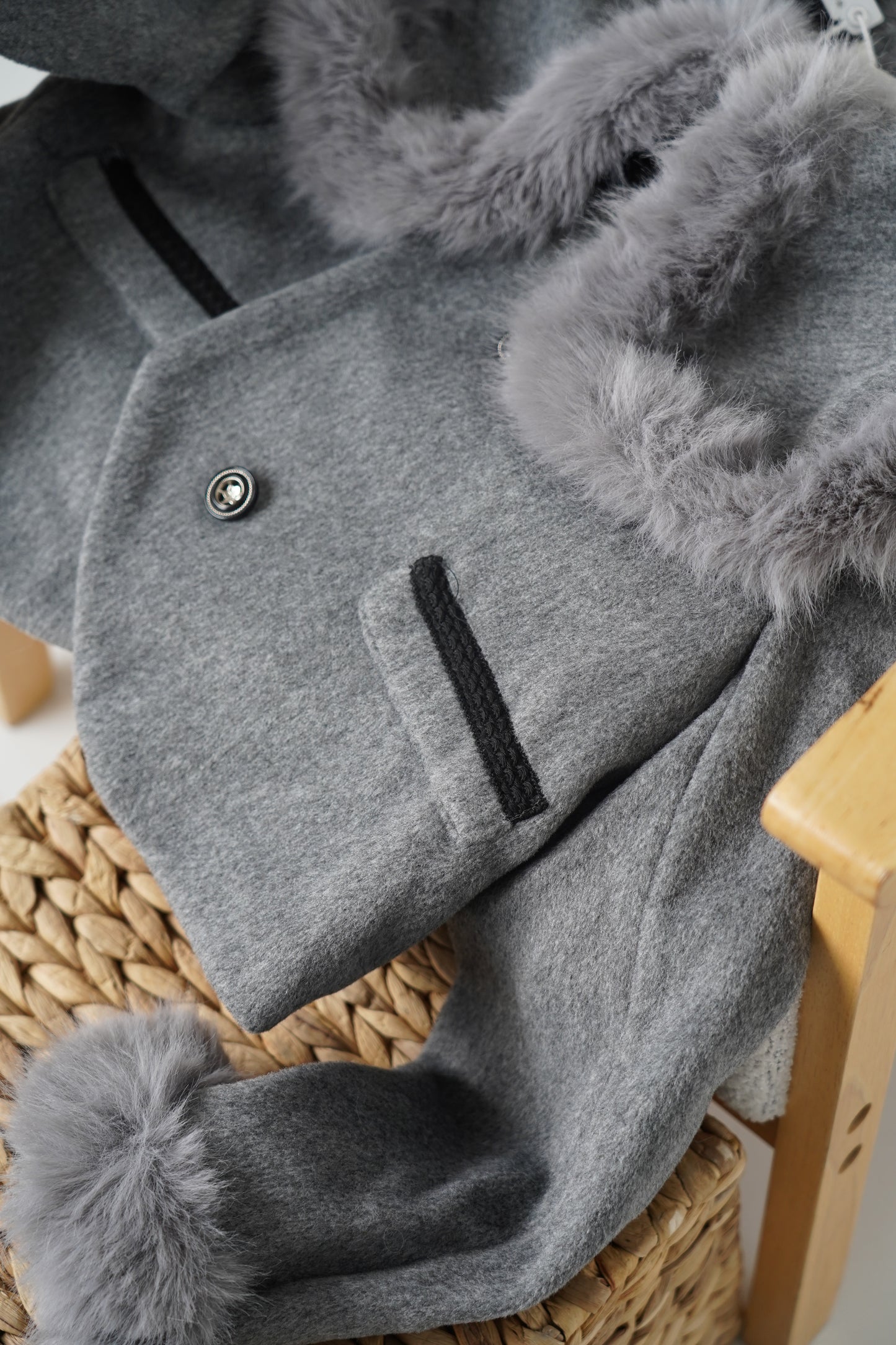 Grey jacket with luxurious faux fur details on the collar and cuffs