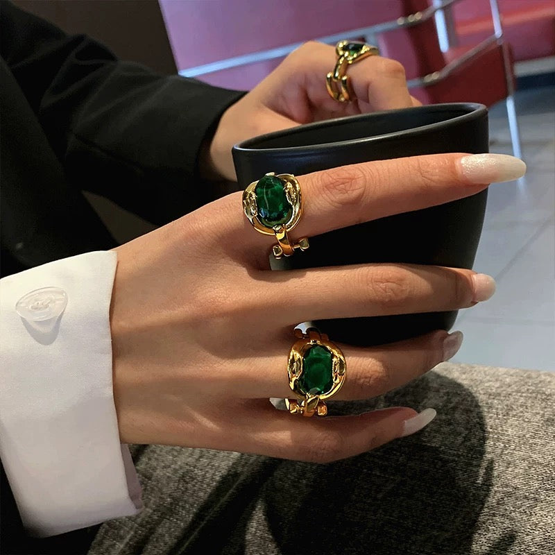 Elegant Gold Ring with Green Gemstone