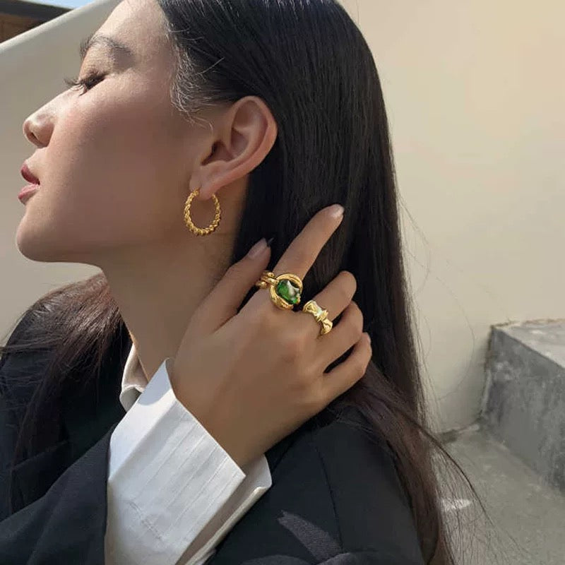 Elegant Gold Ring with Green Gemstone