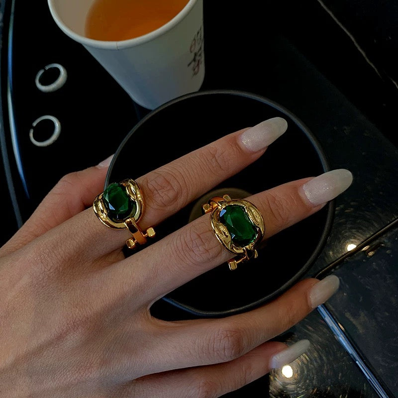 Elegant Gold Ring with Green Gemstone