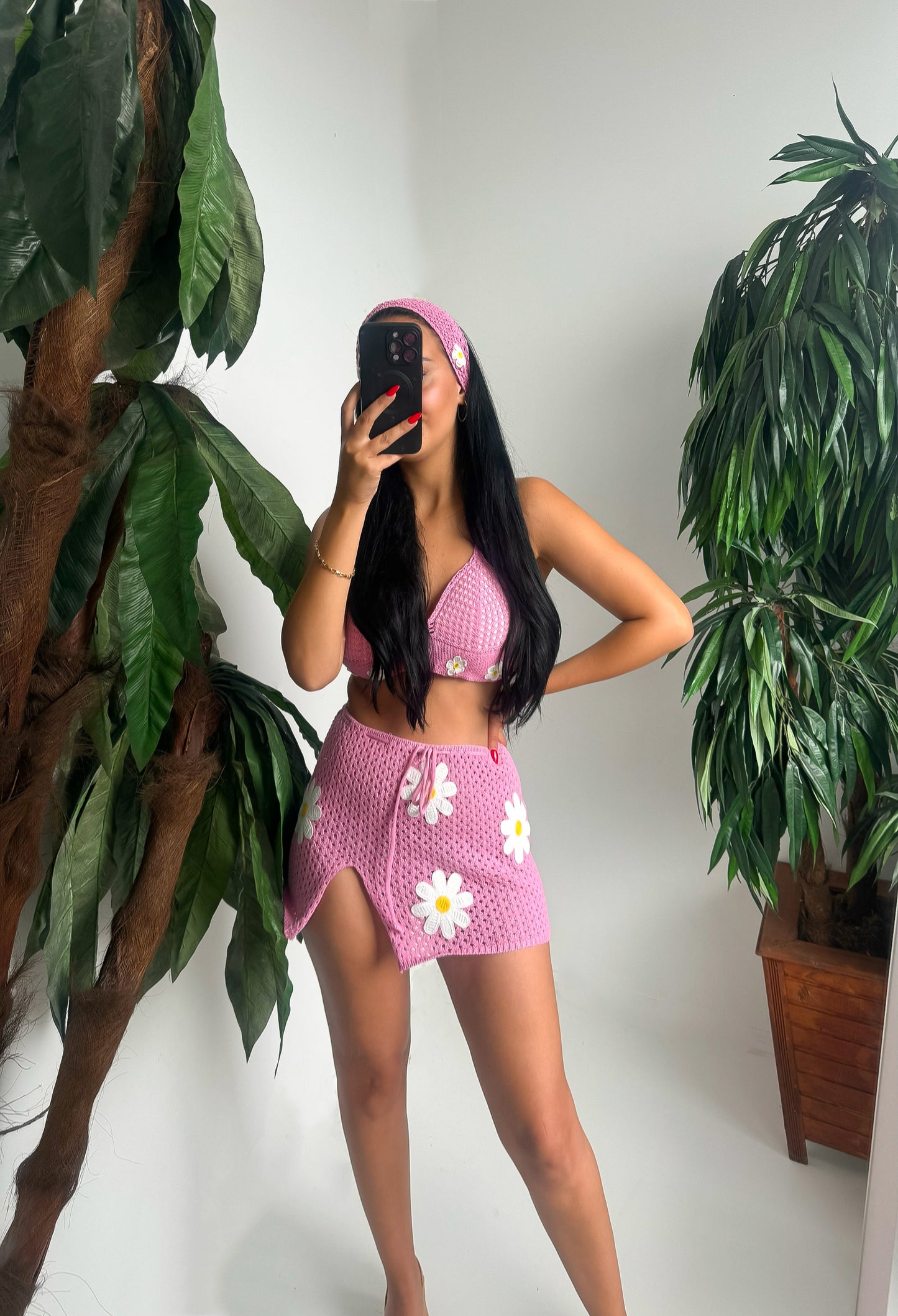 Brighten up your summer with this handmade crochet set – featuring a daisy-embroidered crop top, a matching mini skirt with side slit, and a cute headband to complete the look.