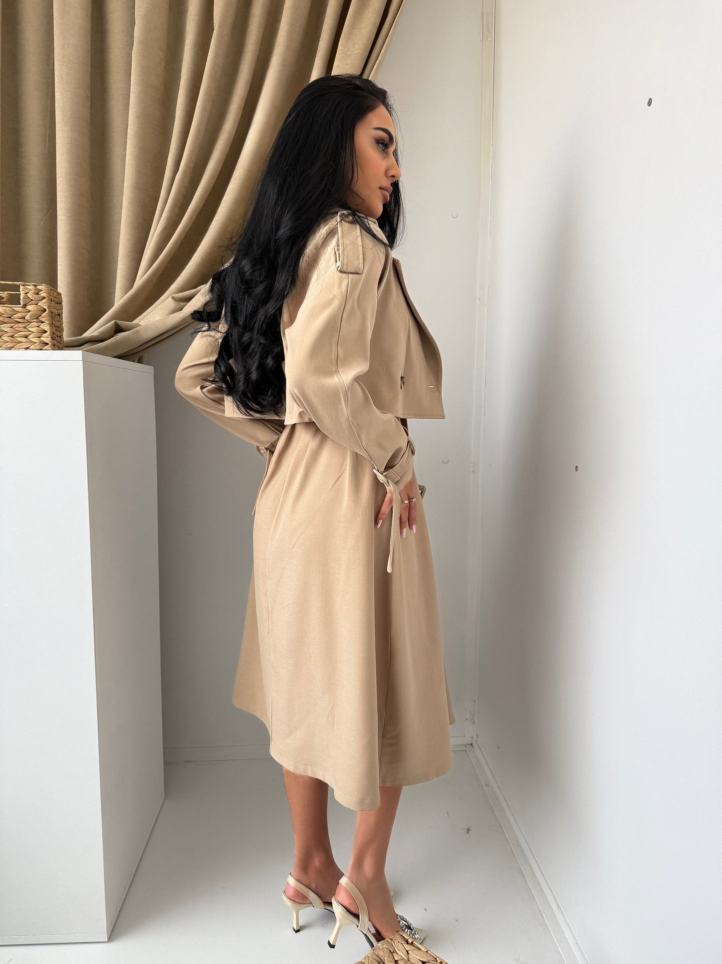 Two-piece set featuring a stylish dress and matching trench-style jacket.