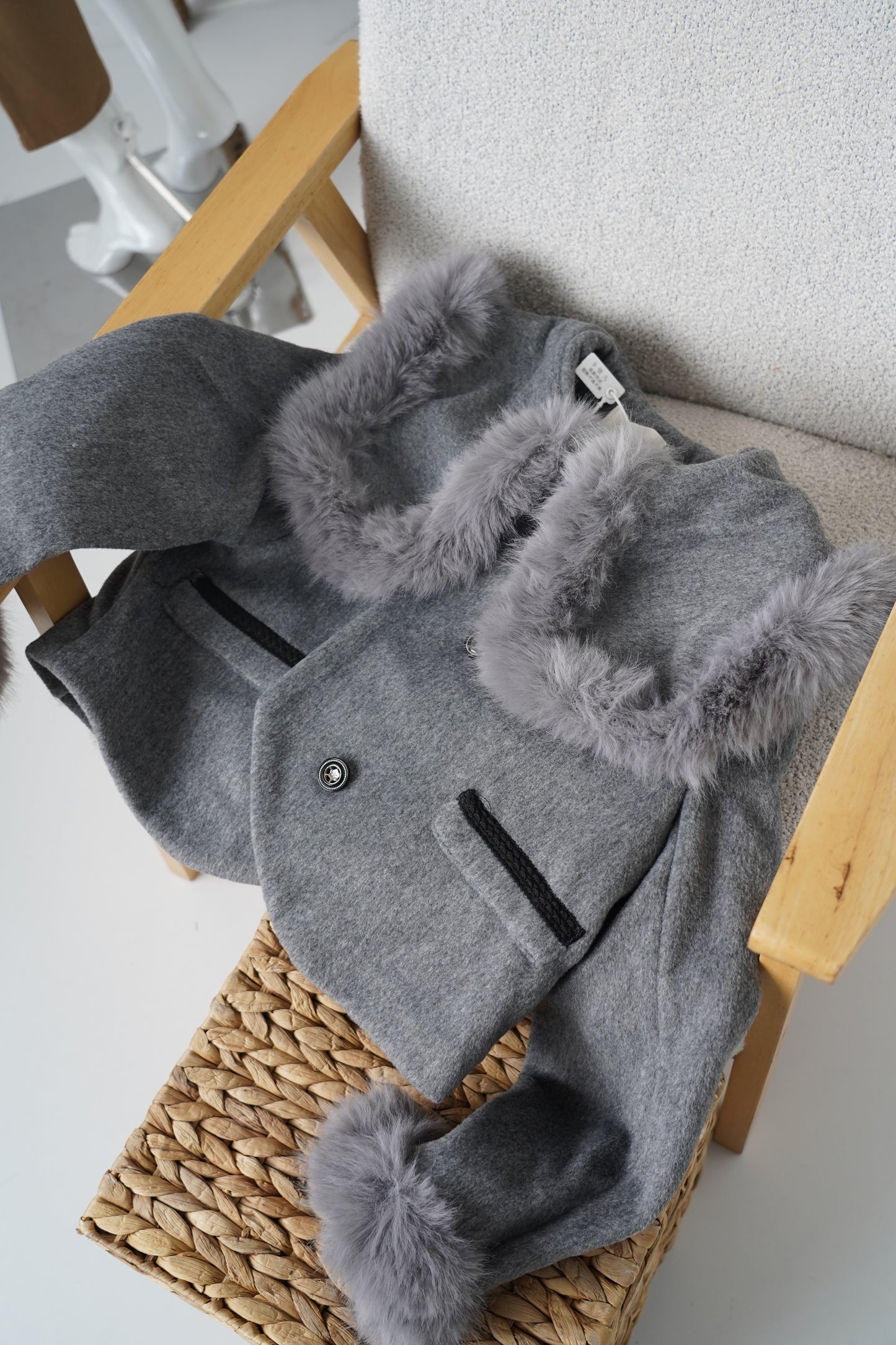 Grey jacket with luxurious faux fur details on the collar and cuffs