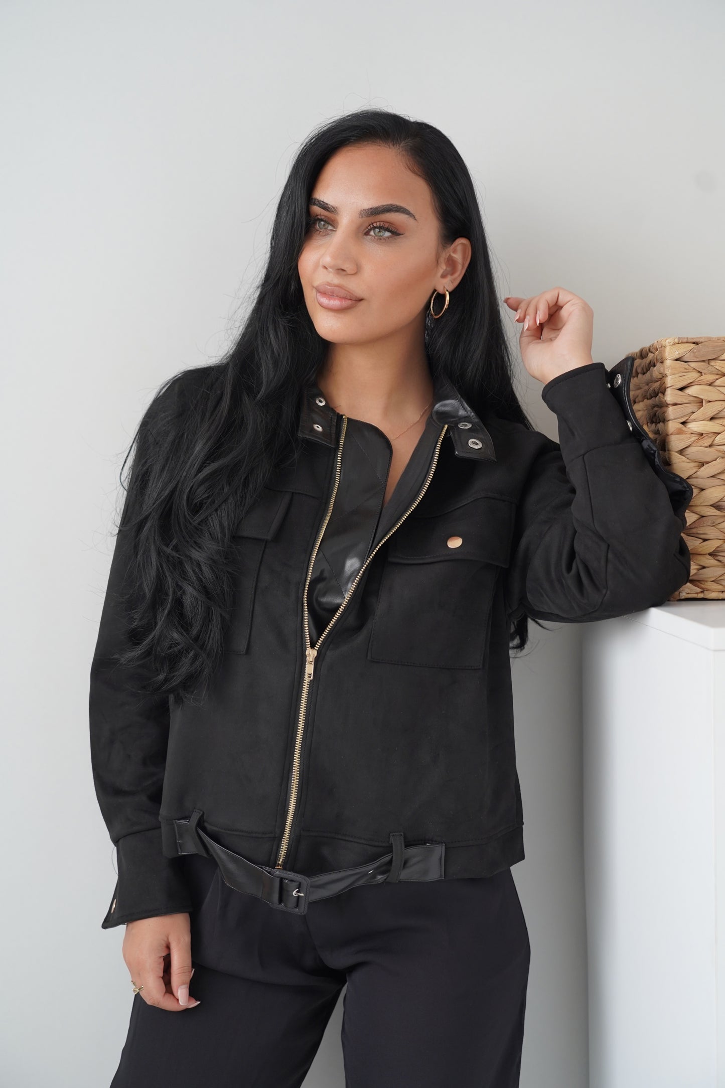 Chic black jacket with a modern touch, featuring a front zip closure