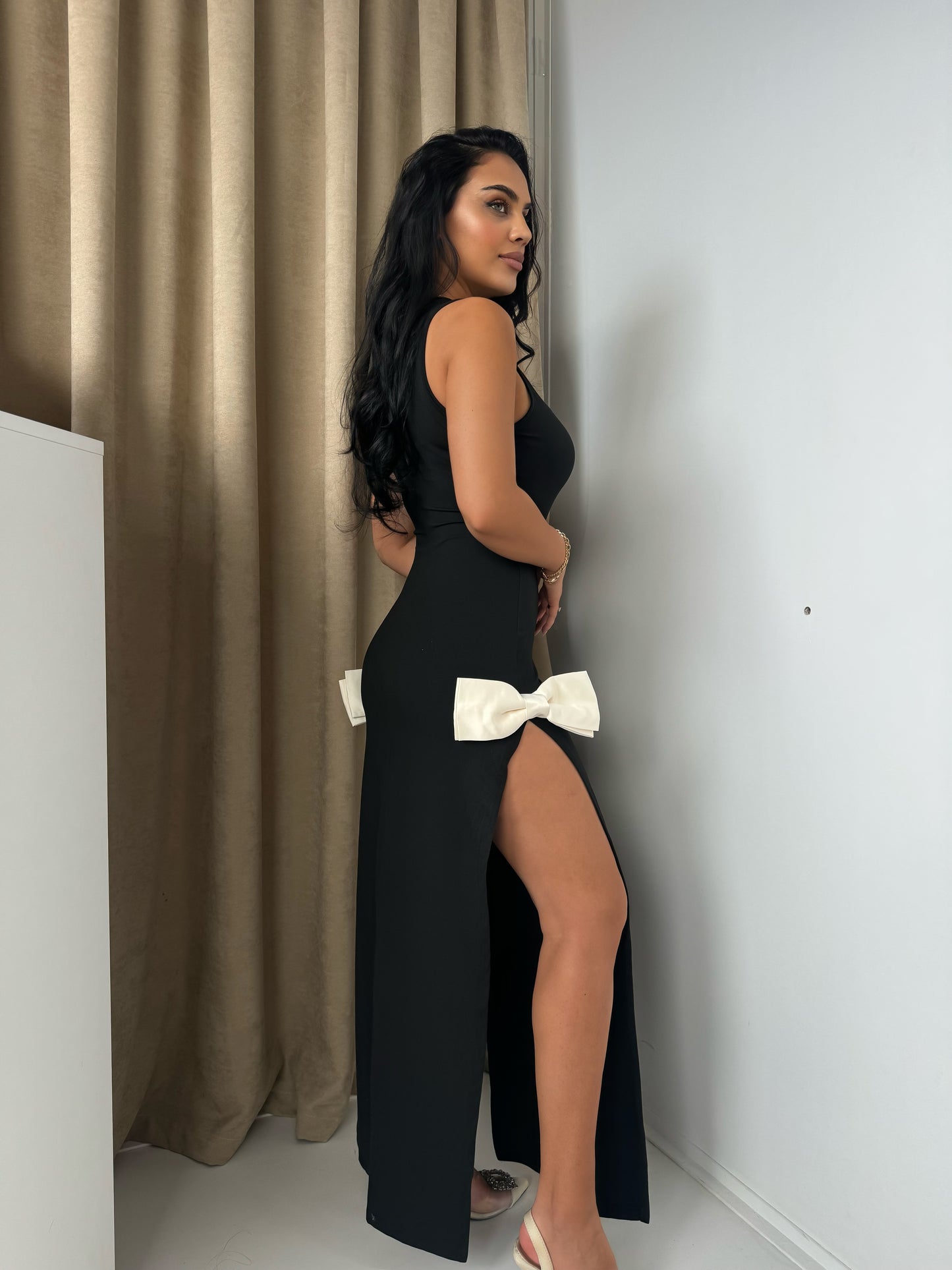 Elegant Black Maxi Dress with Side Slit and Bow Details
