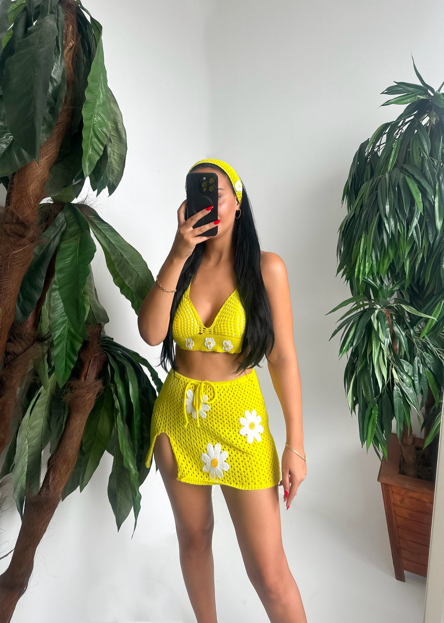 Brighten up your summer with this handmade crochet set – featuring a daisy-embroidered crop top, a matching mini skirt with side slit, and a cute headband to complete the look.