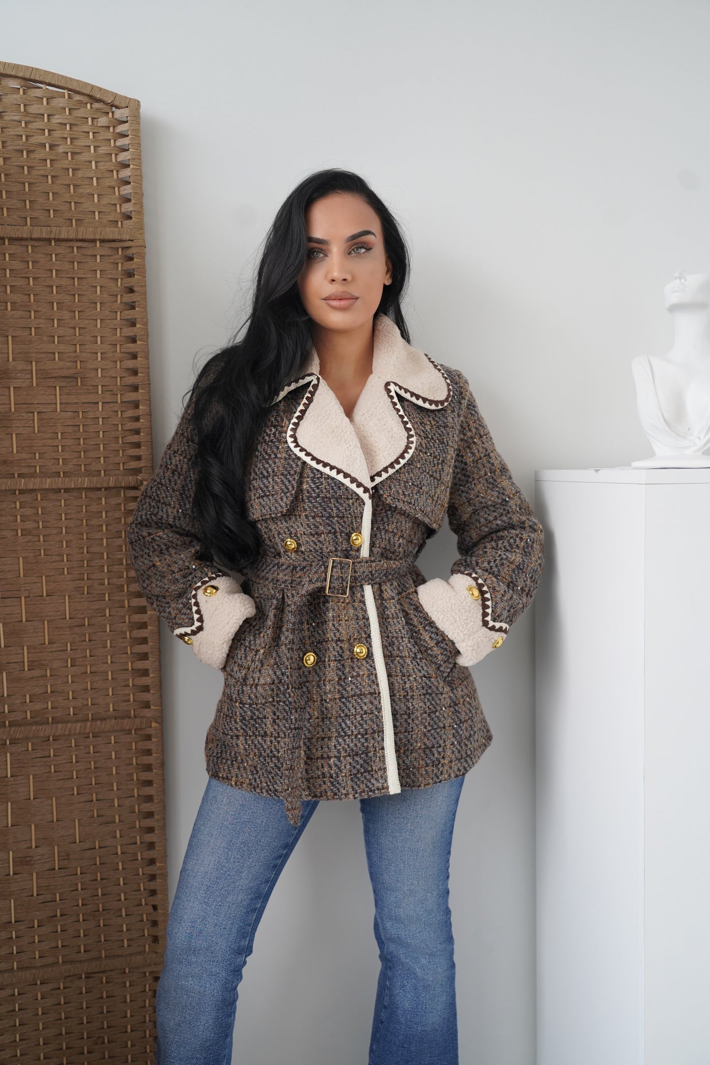 An elegant boucle jacket crafted in a woven brown and grey pattern