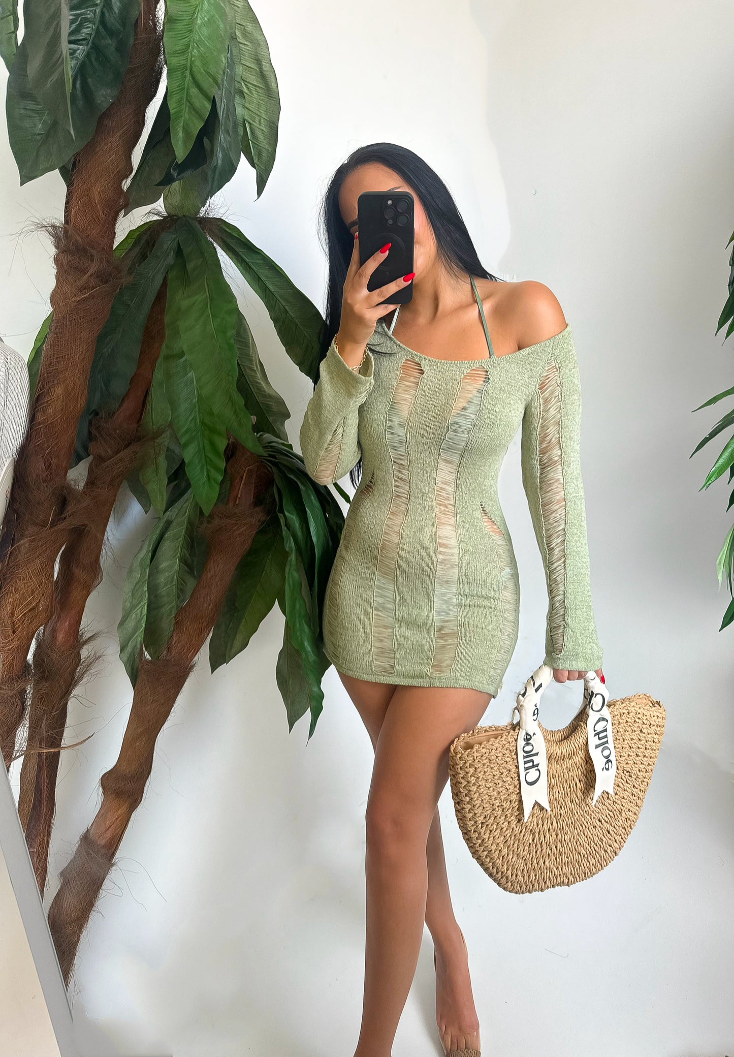 Ripped-detail bodycon dress with long sleeves and off-shoulder cut. Perfect for beach days or vacation looks. Comfortable, bold, and ready to turn heads.