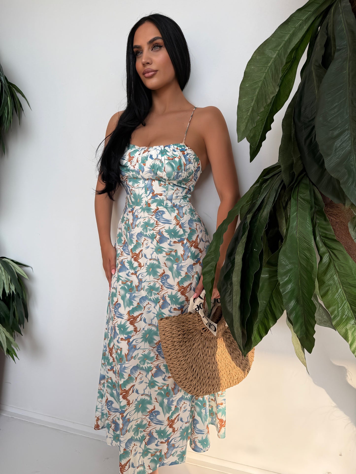 Step into summer with elegance and ease in this stunning tropical print maxi dress.
