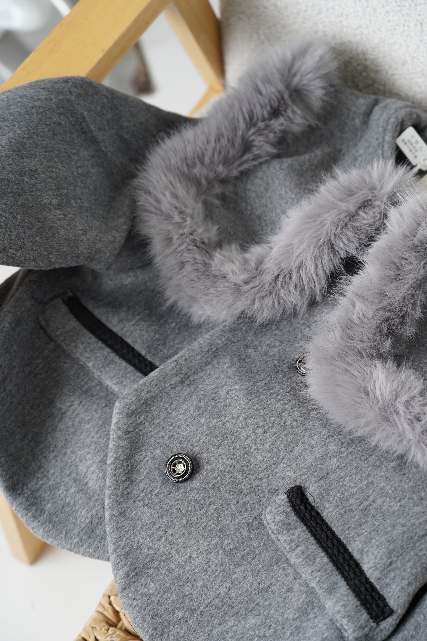 Grey jacket with luxurious faux fur details on the collar and cuffs