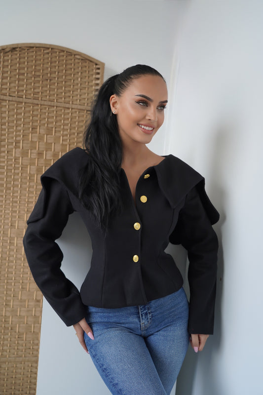 Elegance with a modern twist — this structured black jacket with bold gold buttons brings sophistication and power to your everyday style