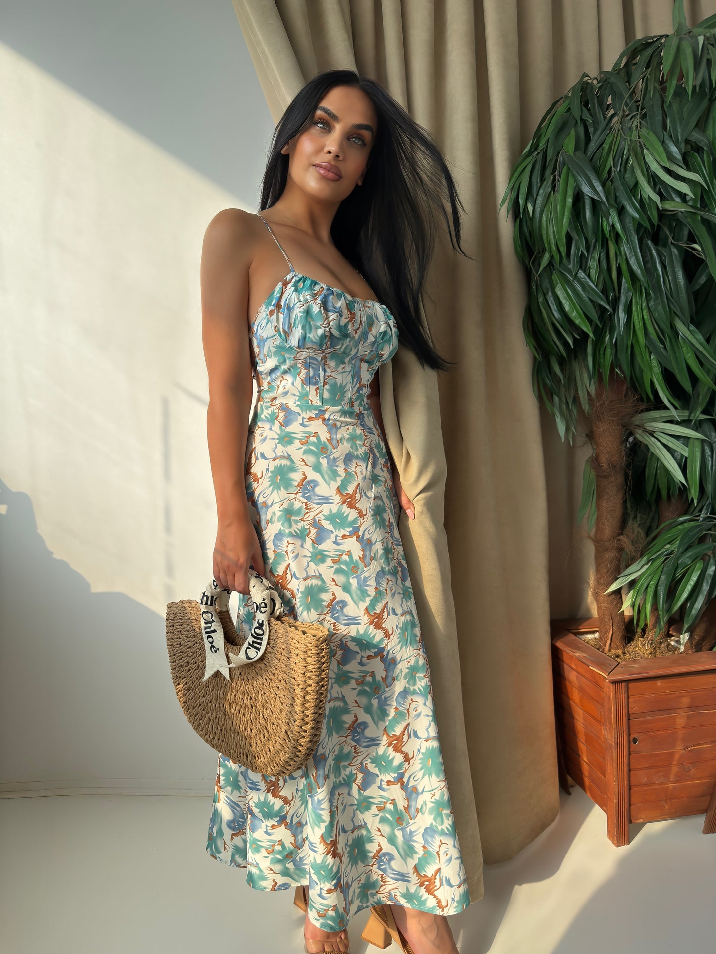Step into summer with elegance and ease in this stunning tropical print maxi dress.