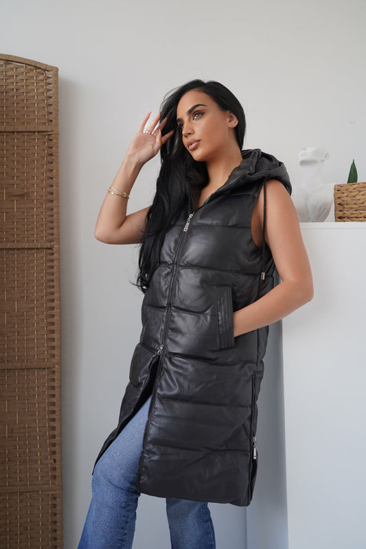 Long sleeveless padded vest designed for comfort and warmth.