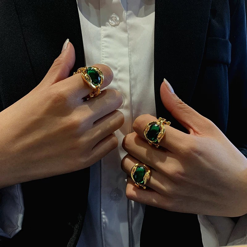 Elegant Gold Ring with Green Gemstone