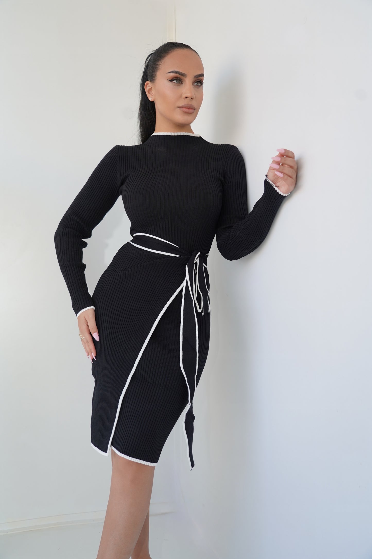 Black knit dress with white contrast details