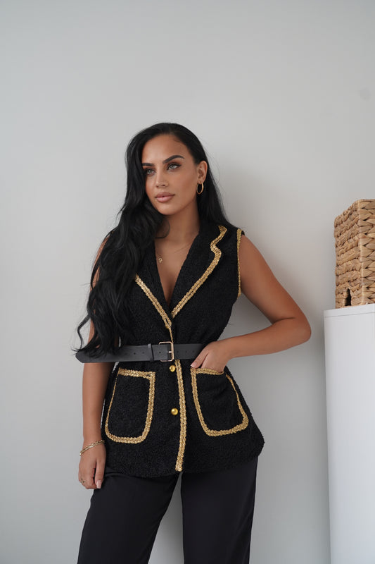 Elegant sleeveless black vest with golden braided trim
