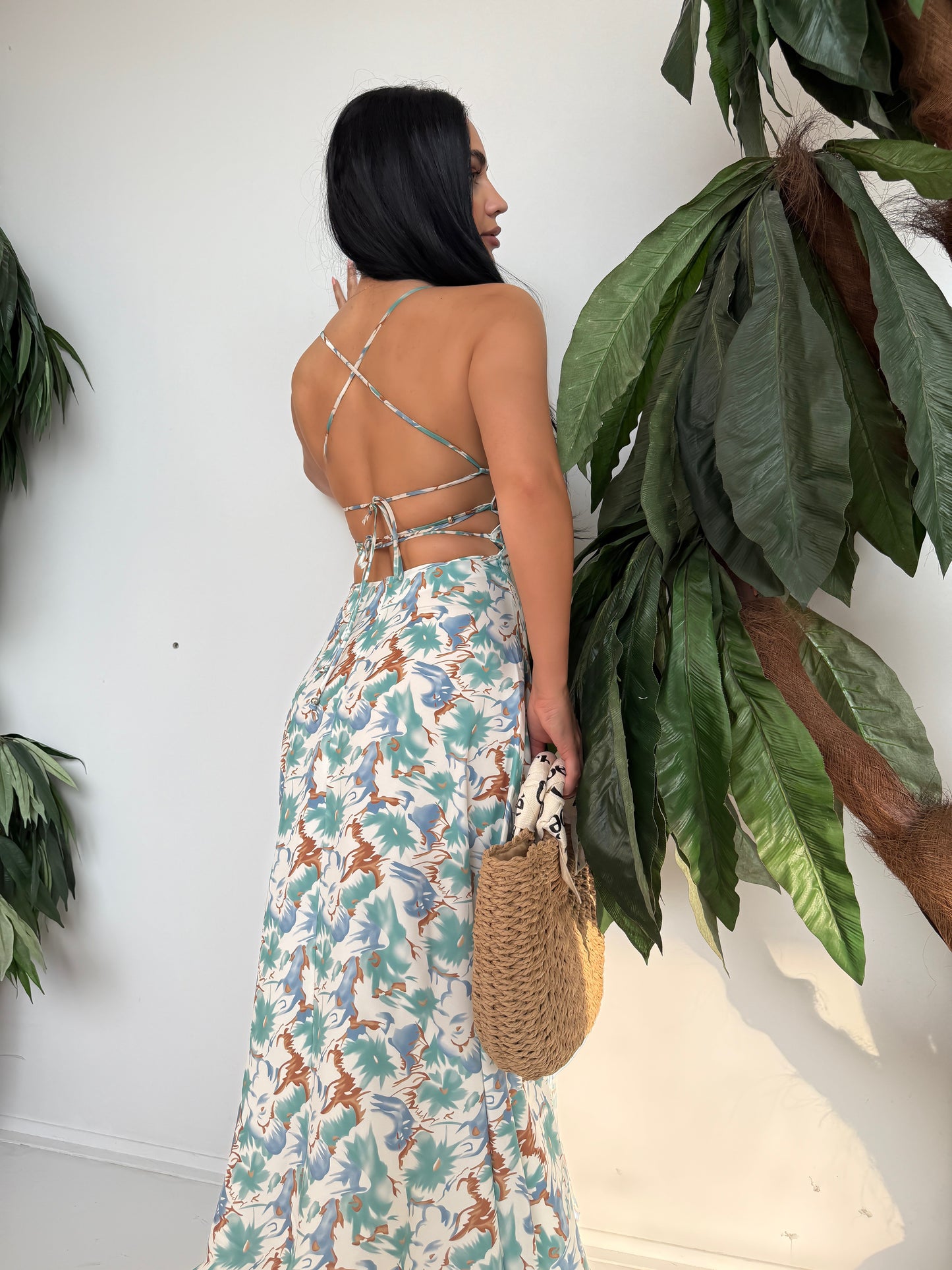 Step into summer with elegance and ease in this stunning tropical print maxi dress.
