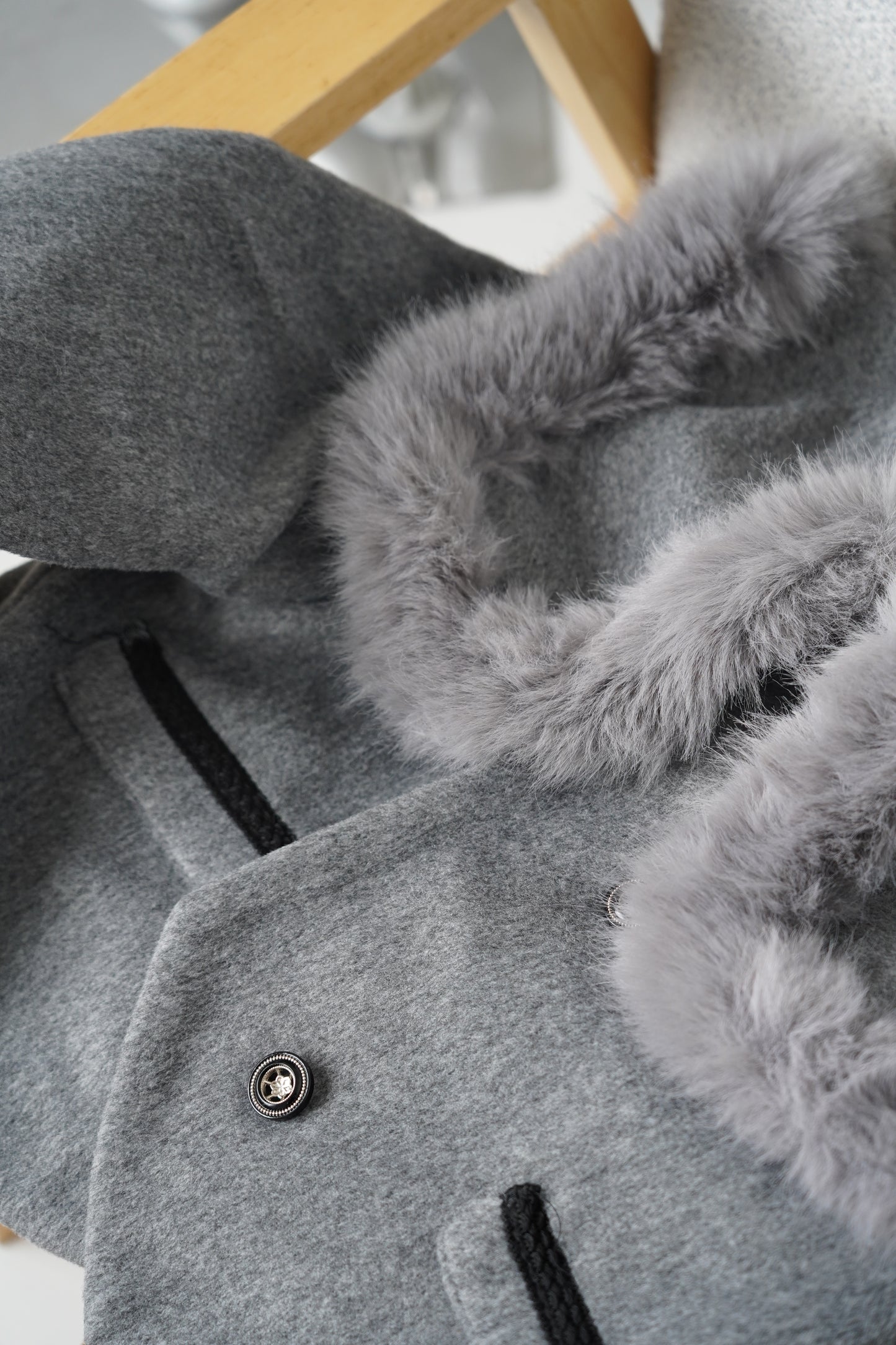 Grey jacket with luxurious faux fur details on the collar and cuffs