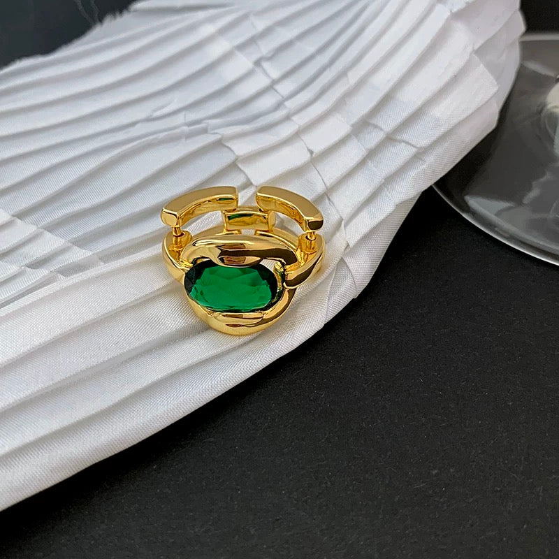 Elegant Gold Ring with Green Gemstone
