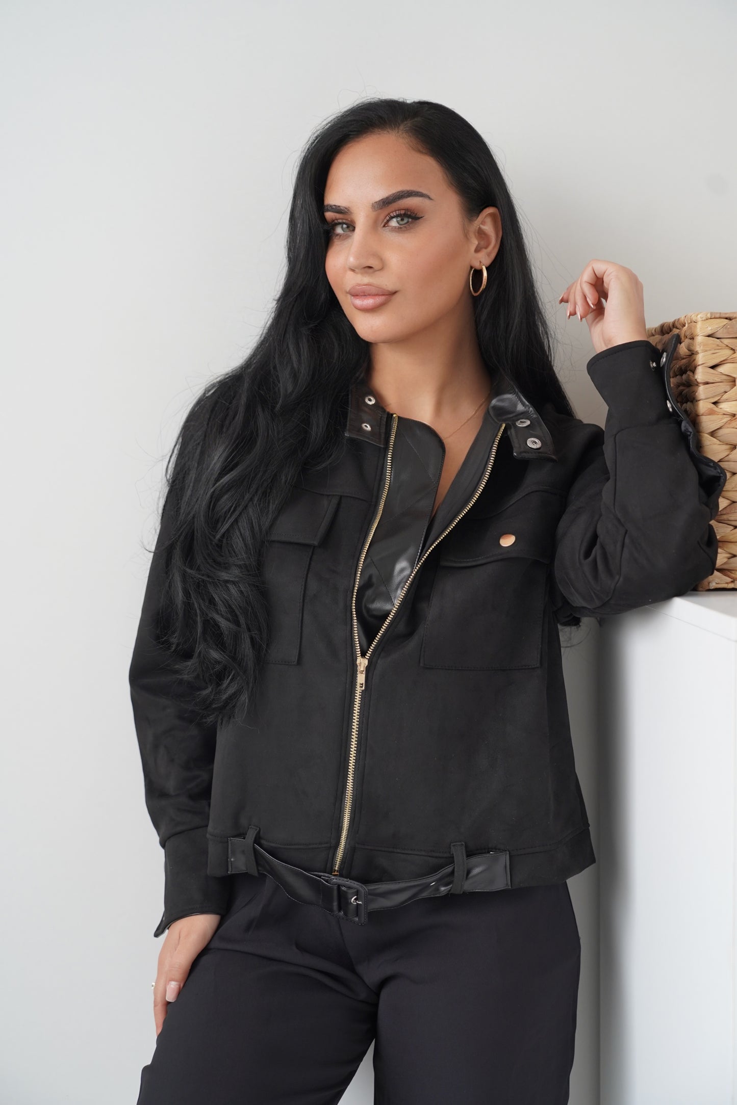 Chic black jacket with a modern touch, featuring a front zip closure