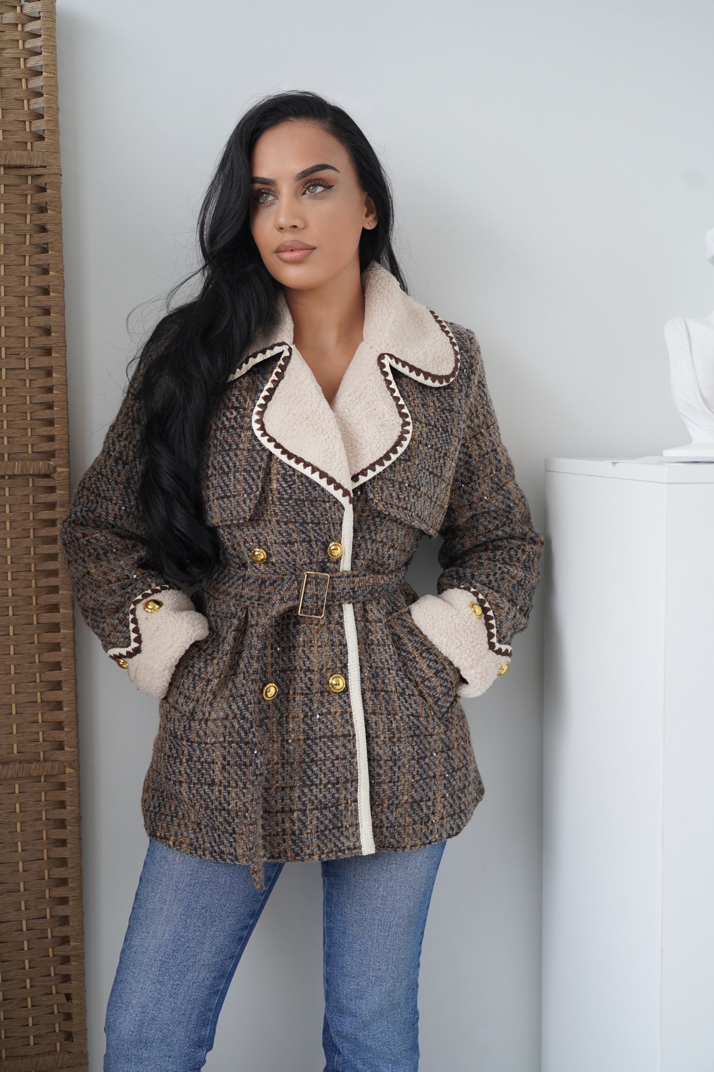 An elegant boucle jacket crafted in a woven brown and grey pattern