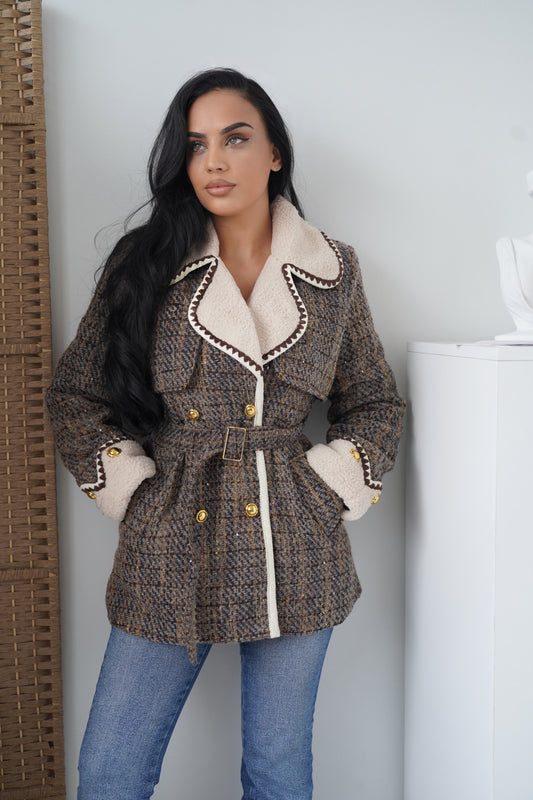 An elegant boucle jacket crafted in a woven brown and grey pattern