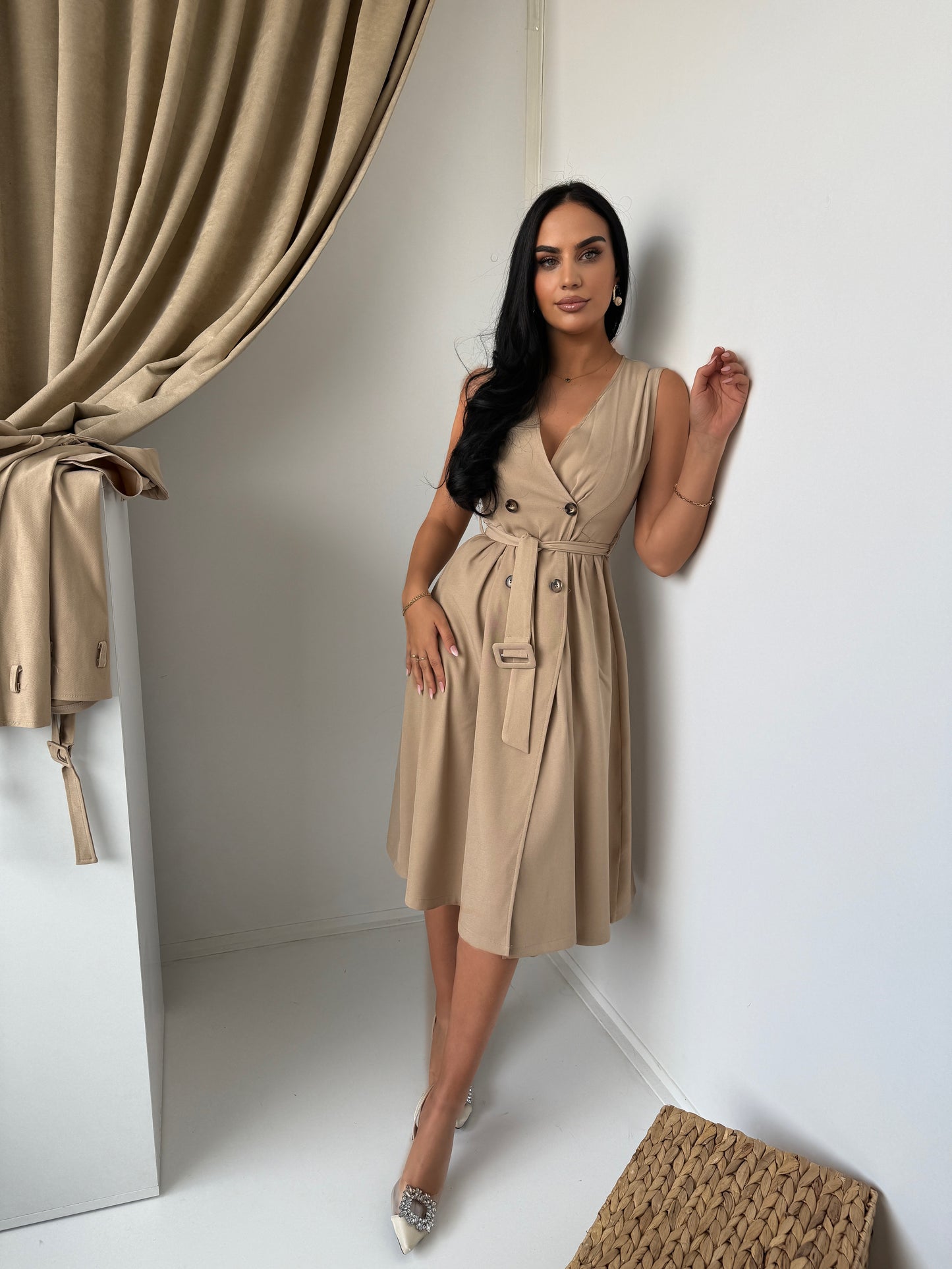 Two-piece set featuring a stylish dress and matching trench-style jacket.