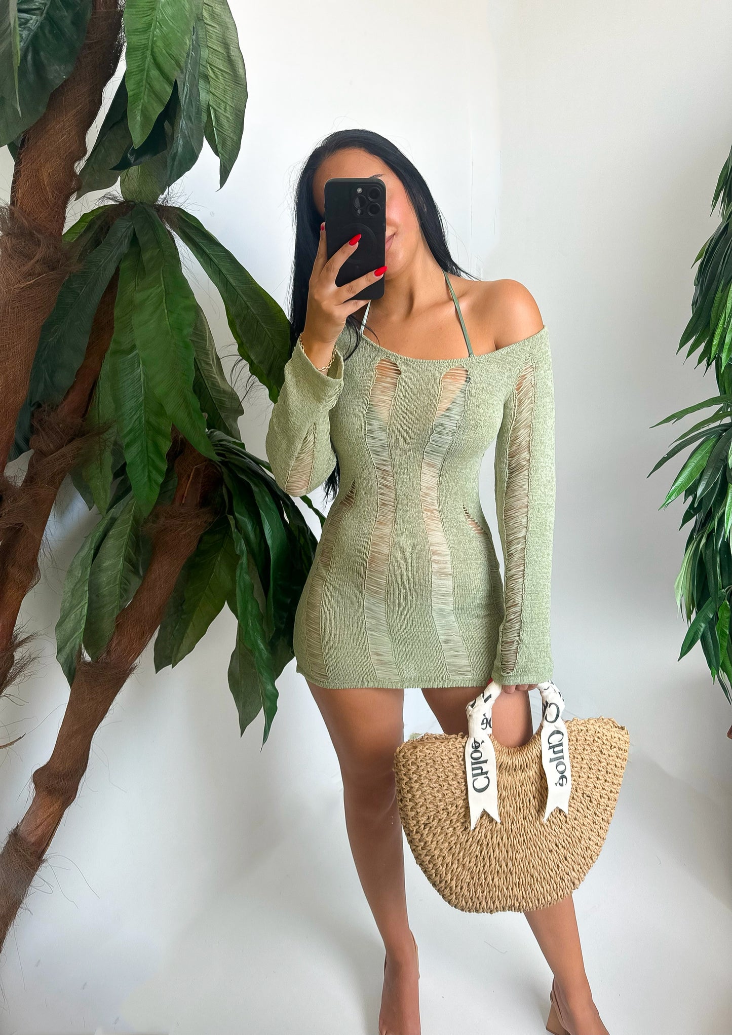 Ripped-detail bodycon dress with long sleeves and off-shoulder cut. Perfect for beach days or vacation looks. Comfortable, bold, and ready to turn heads.