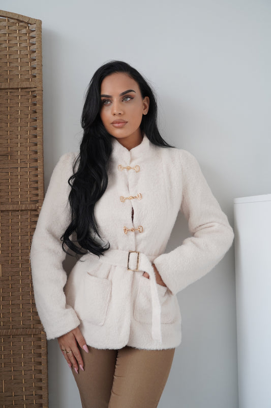 Elegant cream-colored jacket made from a soft, warm fabric, designed for a chic and sophisticated look.