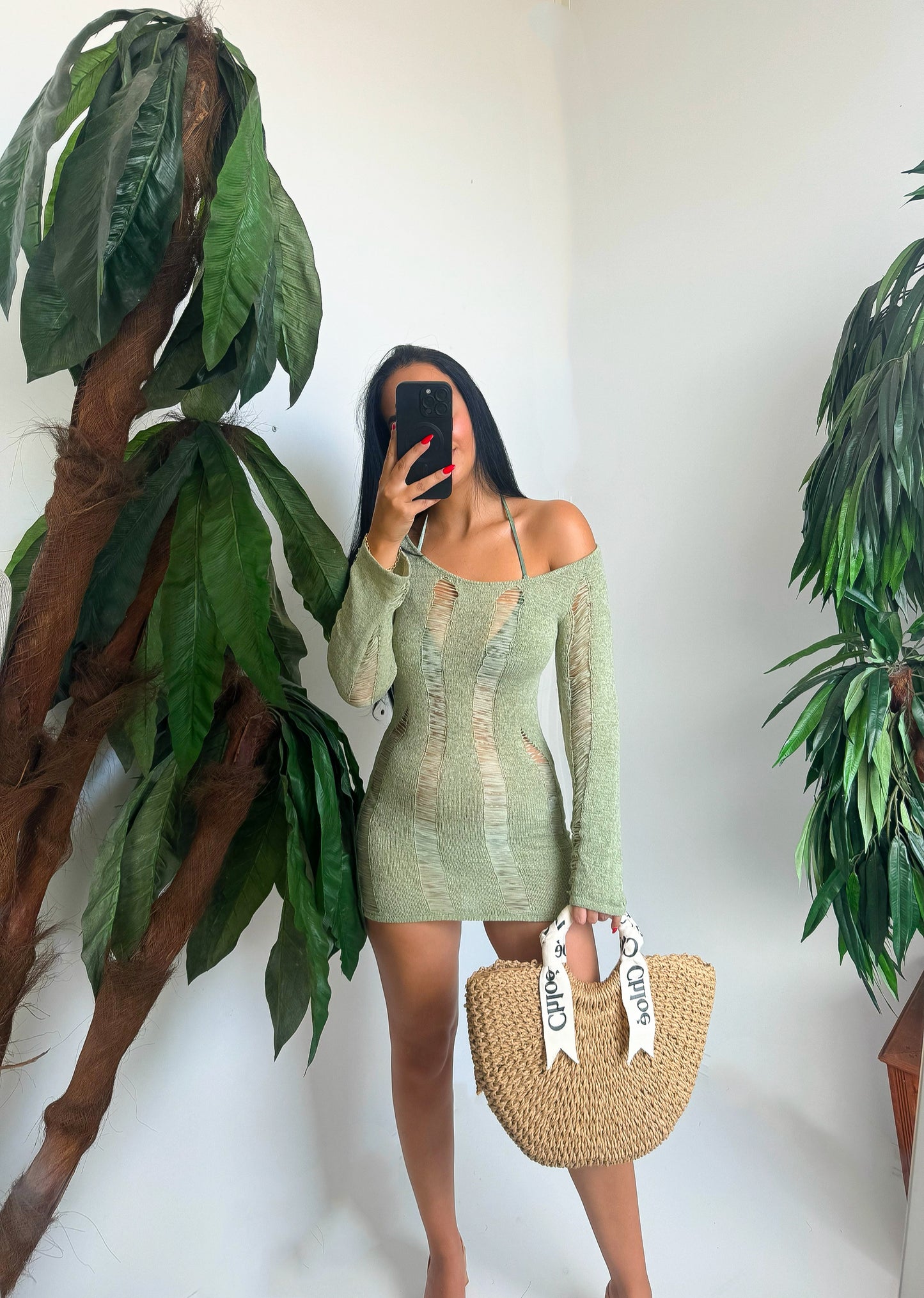 Ripped-detail bodycon dress with long sleeves and off-shoulder cut. Perfect for beach days or vacation looks. Comfortable, bold, and ready to turn heads.
