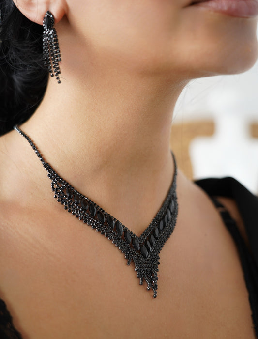 Stunning black jewelry set featuring a statement V-shaped necklace